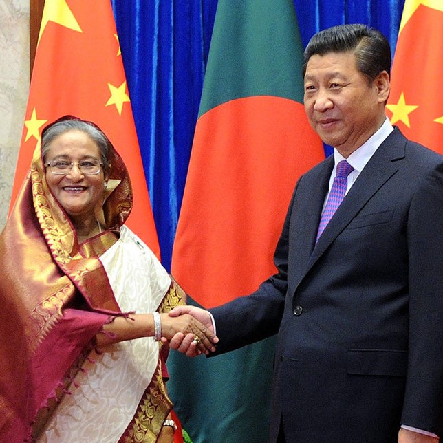 Bangladesh's Prime Minister Sheikh Hasina, left, shakes hands with Chinese President Xi Jinping at the Great Hall of the People in Beijing on Tuesday, June 10, 2014. (AP Photo/Wang Zhao, Pool)